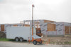 Residential construction site with the Worksite Hawk set up curbside. The best way to learn about the Worksite Hawk is to call us at 305-290-2299 x. 708. Give us a call for a no pressure chat about how your company can enhance your worksite security and jobsite productivity monitoring. Hablamos Español!